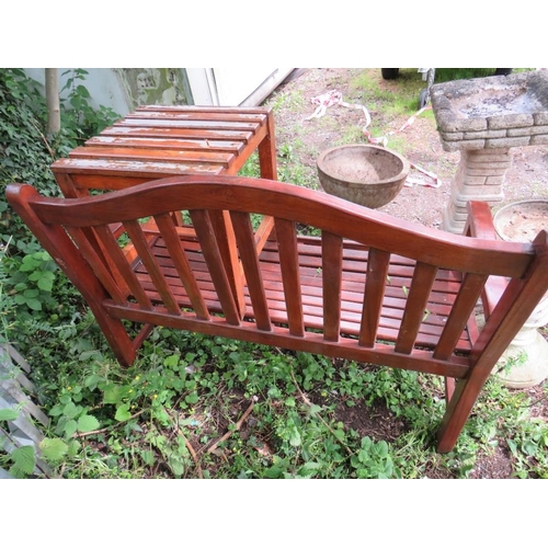 560 - A HARDWOOD GARDEN BENCH AND TABLE