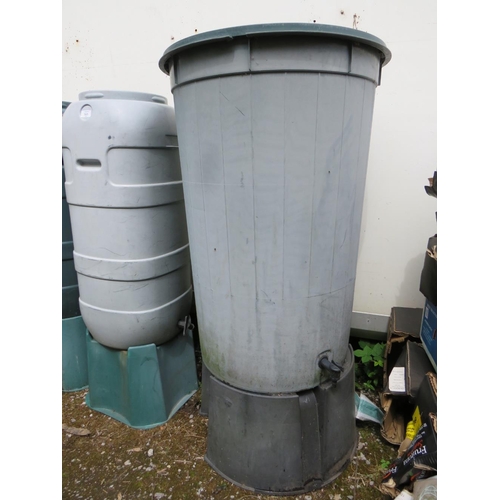 565 - THREE PLASTIC GARDEN WATER BUTTS ON STANDS