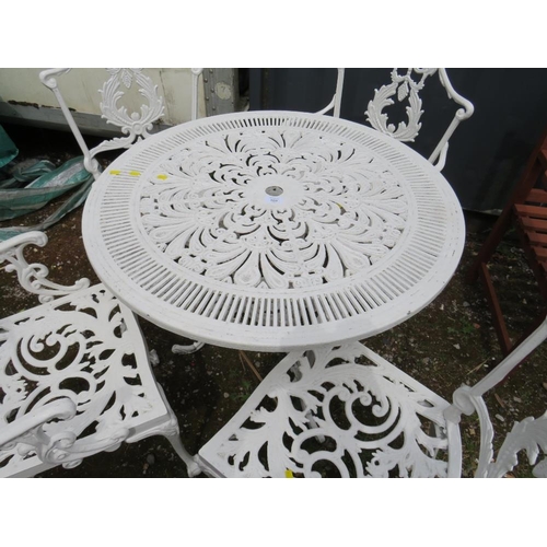 569 - A WHITE PAINTED CAST ALLOY PATIO TABLE AND FOUR CHAIRS