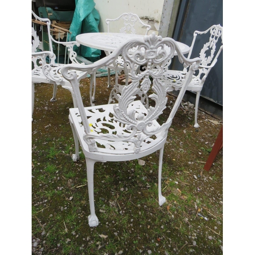 569 - A WHITE PAINTED CAST ALLOY PATIO TABLE AND FOUR CHAIRS