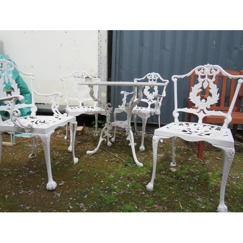 569 - A WHITE PAINTED CAST ALLOY PATIO TABLE AND FOUR CHAIRS