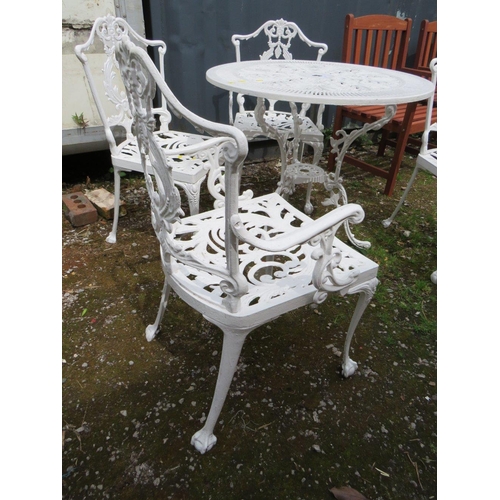 569 - A WHITE PAINTED CAST ALLOY PATIO TABLE AND FOUR CHAIRS