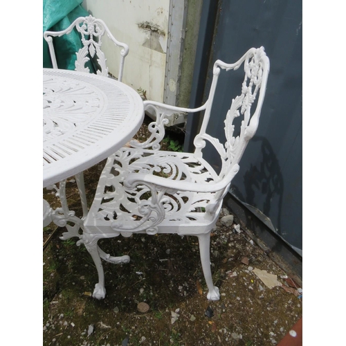 569 - A WHITE PAINTED CAST ALLOY PATIO TABLE AND FOUR CHAIRS