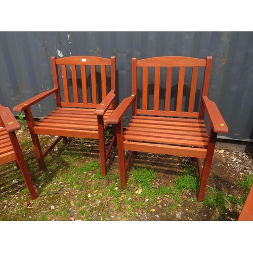 570 - A SET OF FOUR HARDWOOD GARDEN ARMCHAIRS