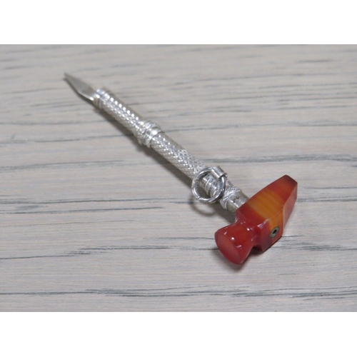 213 - AN ANTIQUE SILVER AND AGATE NOVELTY TOOTH PICK