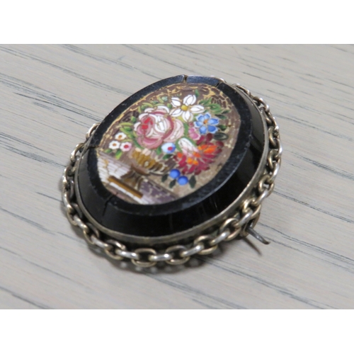 214 - AN ANTIQUE SILVER MICRO MOSAIC BROOCH