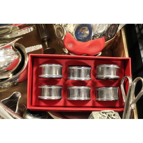 79 - A TRAY OF ASSORTED METALWARE TO INCLUDE A THREE PIECE TEASET, NAPKIN RINGS ETC