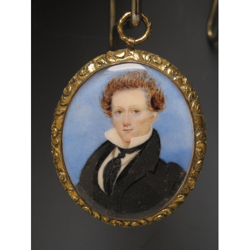 100 - A 19TH CENTURY OVAL PORTRAIT MINIATURE OF A GEORGIAN GENTLEMAN, with black coat and tie, unsigned, i... 