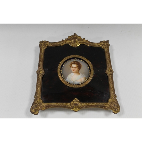96 - A 19TH CENTURY CIRCULAR PORTRAIT STUDY OF A YOUNG WOMAN ON CERAMIC PANEL, unsigned, framed in decora... 