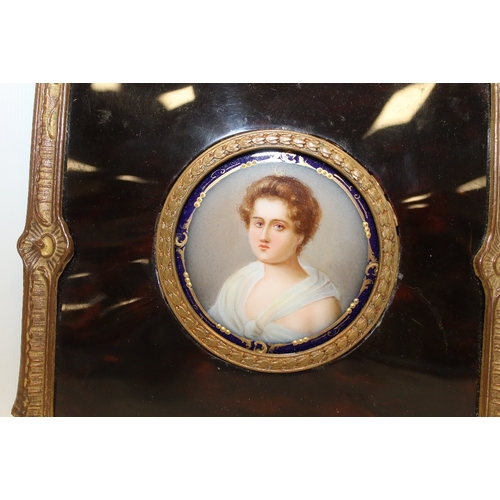 96 - A 19TH CENTURY CIRCULAR PORTRAIT STUDY OF A YOUNG WOMAN ON CERAMIC PANEL, unsigned, framed in decora... 