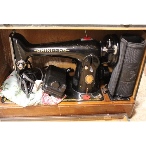 148 - A VINTAGE CASED ELECTRIC SINGER SEWING MACHINE