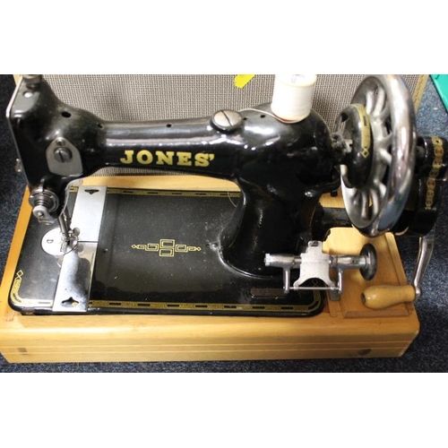 164 - A CASE VINTAGE JONES SEWING MACHINE