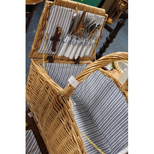 230 - A WICKER DOUBLE SIDED PICNIC HAMPER AND CONTENTS