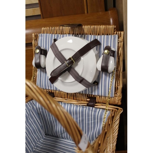 230 - A WICKER DOUBLE SIDED PICNIC HAMPER AND CONTENTS