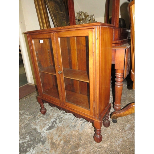 801 - A SMALL MAHOGANY TWO DOOR GLAZED BOOKCASE - W 69 cm