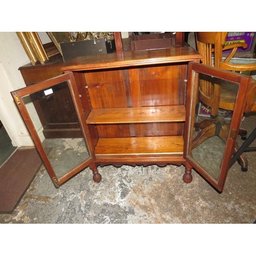 801 - A SMALL MAHOGANY TWO DOOR GLAZED BOOKCASE - W 69 cm