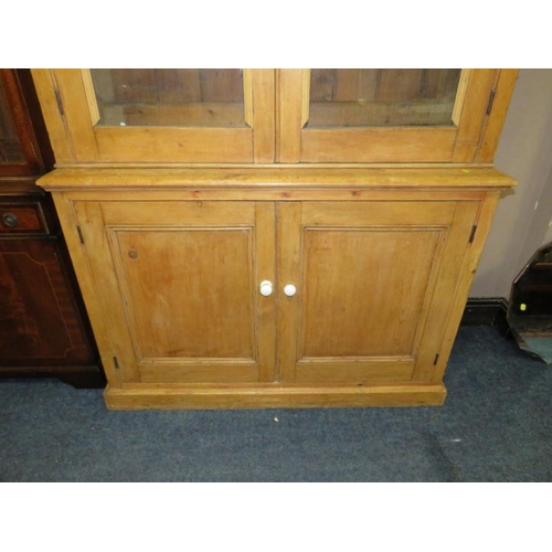 819 - AN ANTIQUE PINE GLAZED HOUSEKEEPERS CUPBOARD - H 210 cm, W 132 cm