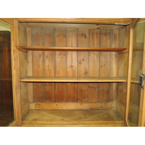 819 - AN ANTIQUE PINE GLAZED HOUSEKEEPERS CUPBOARD - H 210 cm, W 132 cm