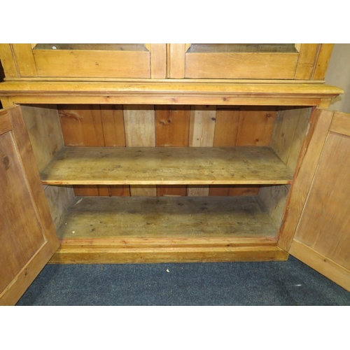 819 - AN ANTIQUE PINE GLAZED HOUSEKEEPERS CUPBOARD - H 210 cm, W 132 cm