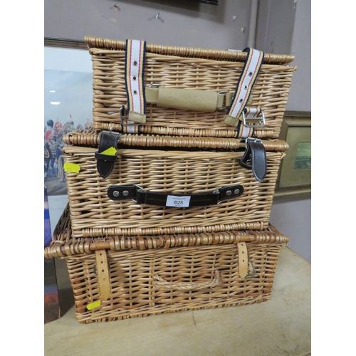 825 - THREE WICKER PICNIC HAMPERS TOGETHER WITH TWO UNOPENED JIGSAWS