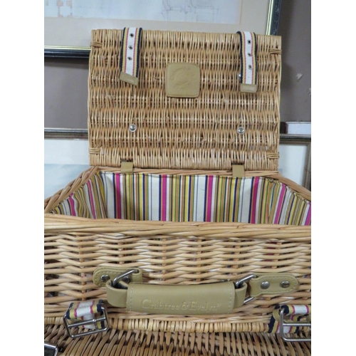 825 - THREE WICKER PICNIC HAMPERS TOGETHER WITH TWO UNOPENED JIGSAWS