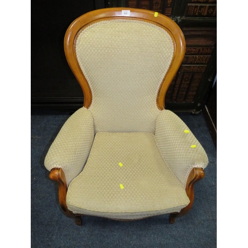 836 - A REPRODUCTION UPHOLSTERED GENTLEMANS ARMCHAIR