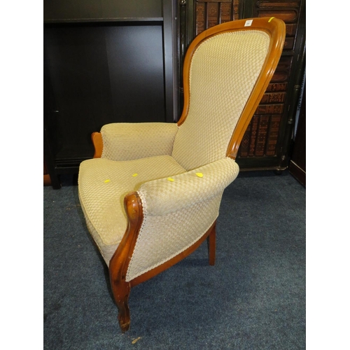 836 - A REPRODUCTION UPHOLSTERED GENTLEMANS ARMCHAIR