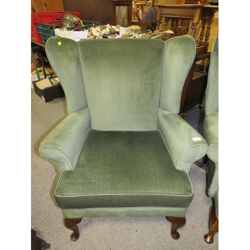 842 - A PAIR OF MODERN UPHOLSTERED WING ARMCHAIRS