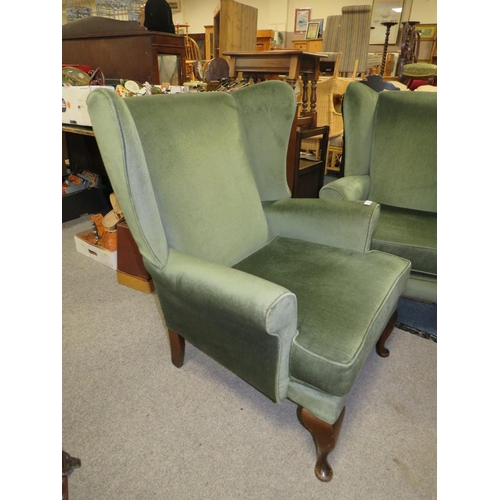 842 - A PAIR OF MODERN UPHOLSTERED WING ARMCHAIRS