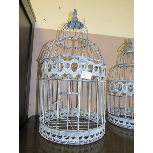 847 - THREE MODERN GRADUATED BIRD CAGES - LARGEST H 48 cm