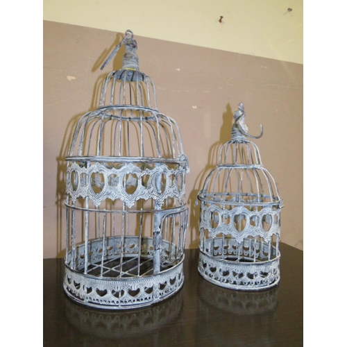 847 - THREE MODERN GRADUATED BIRD CAGES - LARGEST H 48 cm