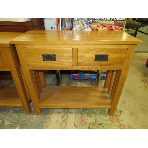 864 - A MODERN LIGHT OAK TWO DRAWER CONSOLE TABLE TOGETHER WITH A SINGLE DRAWER LAMP TABLE (2)