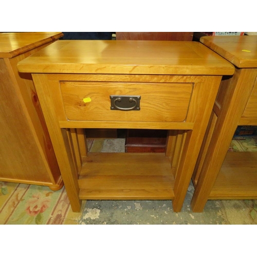 864 - A MODERN LIGHT OAK TWO DRAWER CONSOLE TABLE TOGETHER WITH A SINGLE DRAWER LAMP TABLE (2)