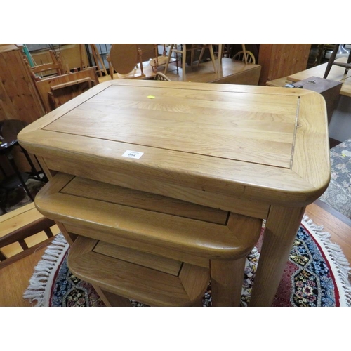 884 - A MODERN OAK NEST OF TABLES - LARGEST W 69 cm