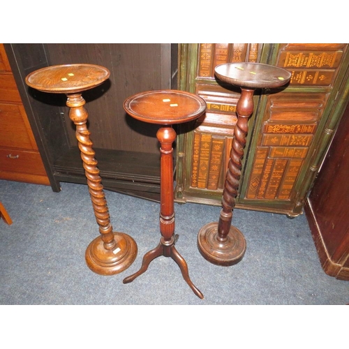 888 - TWO VINTAGE OAK BARLEYTWIST TORCHERES PLUS A MAHOGANY EXAMPLE (3)