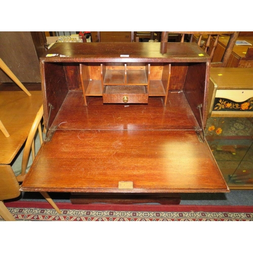 902 - A VINTAGE OAK BUREAU WITH BRASS CARRY HANDLES