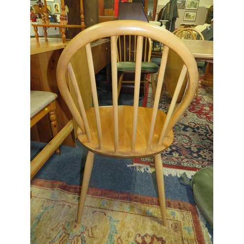 903 - AN ERCOL BLONDE DROPLEAF TABLE & FOUR HOOPBACK CHAIRS