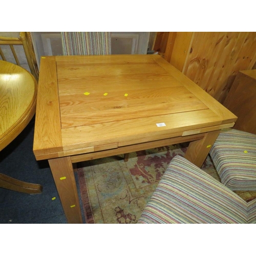 906 - A MODERN OAK FURNITURE LAND DRAWLEAF TABLE AND FOUR CHAIRS