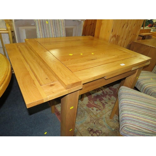 906 - A MODERN OAK FURNITURE LAND DRAWLEAF TABLE AND FOUR CHAIRS