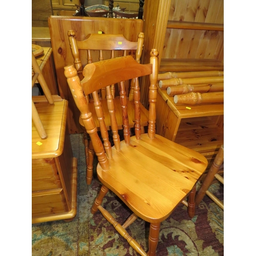 915 - A HONEY PINE BOOKCASE, HEADBOARD, TABLE AND FOUR CHAIRS PLUS A MEDIA CABINET