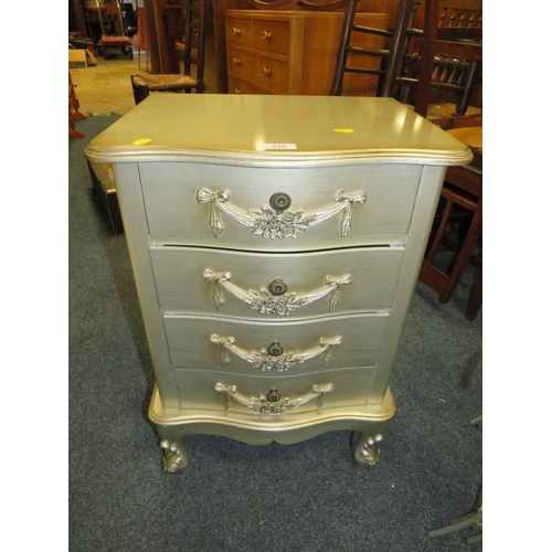 919 - A SMALL SILVER FOUR DRAWER CHEST PLUS A NEST OF GLASS / METAL TABLES (2)