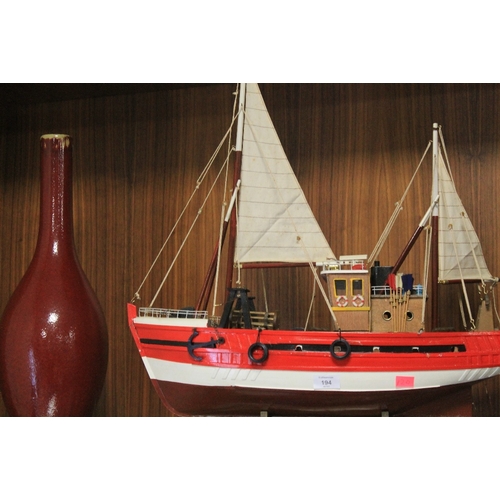 194 - SCRATCH BUILT WOODEN SHIP ON STAND 59 cm LENGTH 62 cm HEIGHT