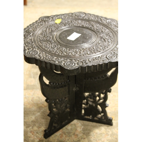 240 - AN EBONISED STYLE ORNATE JARDINIAIRE STAND