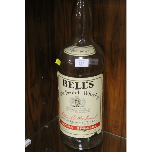 254 - AN EMPTY 4.5 LITRE BELLS WHISKY BOTTLE