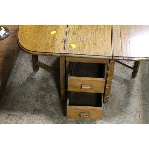 262 - A MINIATURE OAK GATE LEG KITCHEN TABLE