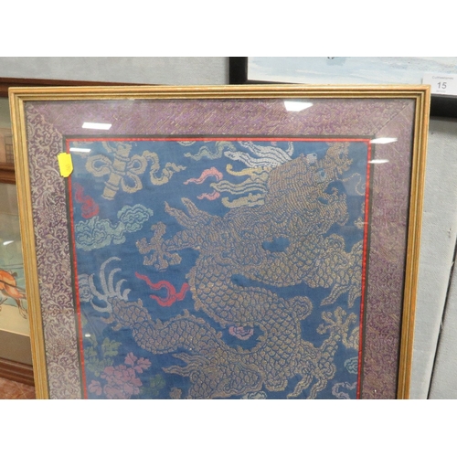 16 - A FRAMED AND GLAZED CHINESE SILKWORK PANEL OF A FIVE TOED DRAGON