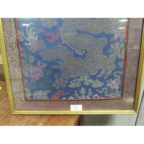 16 - A FRAMED AND GLAZED CHINESE SILKWORK PANEL OF A FIVE TOED DRAGON