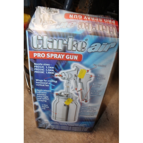 628 - AN AIR COMPRESSOR AND A BOXED SPRAY GUN