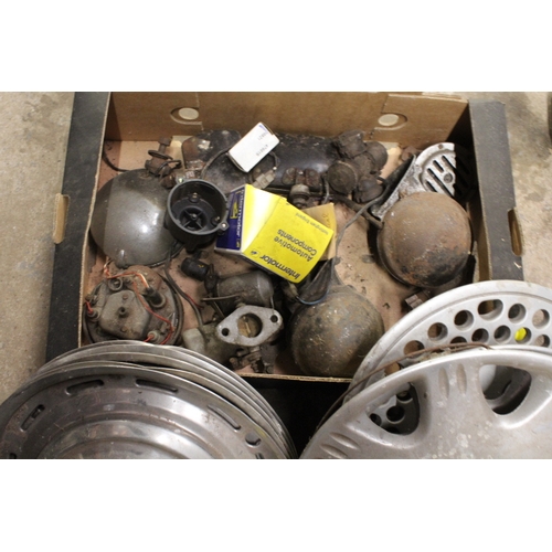 637 - TWO BOXES OF VINTAGE CAR SPARES TO INCLUDE A JOCKEY WHEEL AND CHROME WHEEL DISCS