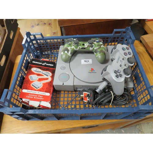 70 - A TRAY CONTAINING PLAYSTATION 1 AND TWO HAND CONTROLLERS